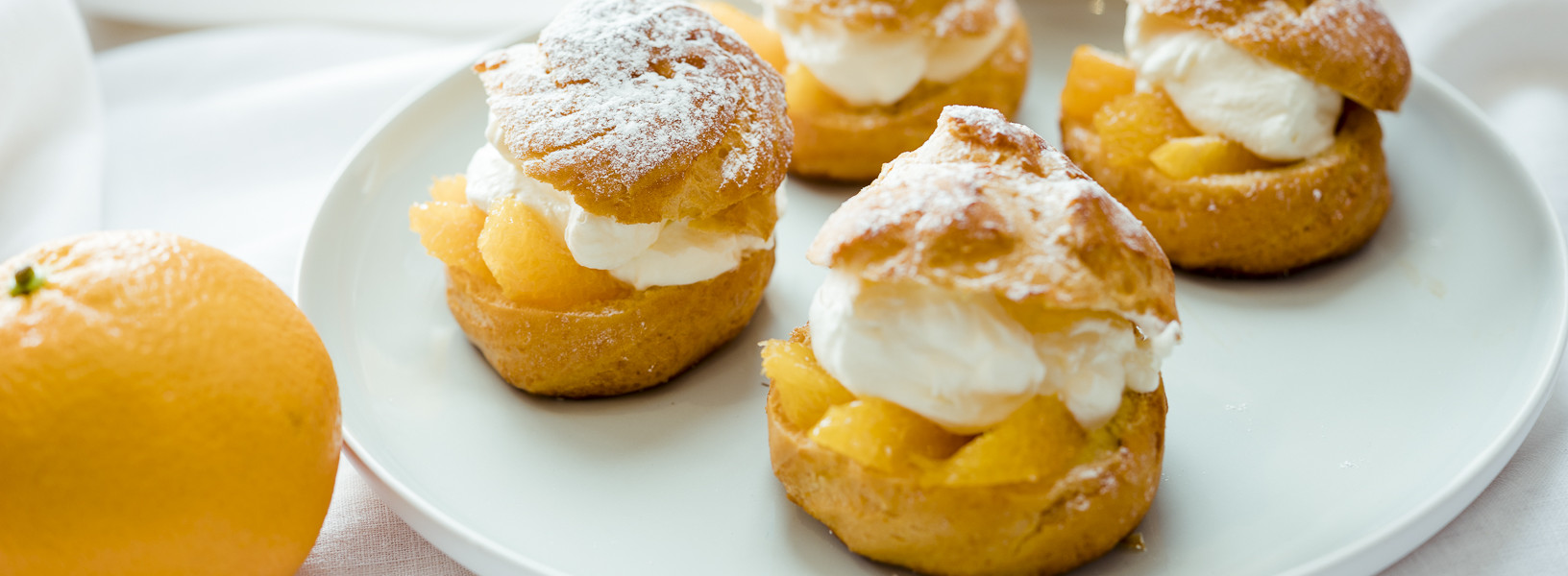 Brandteigkrapfen mit Orangen und Rumobers